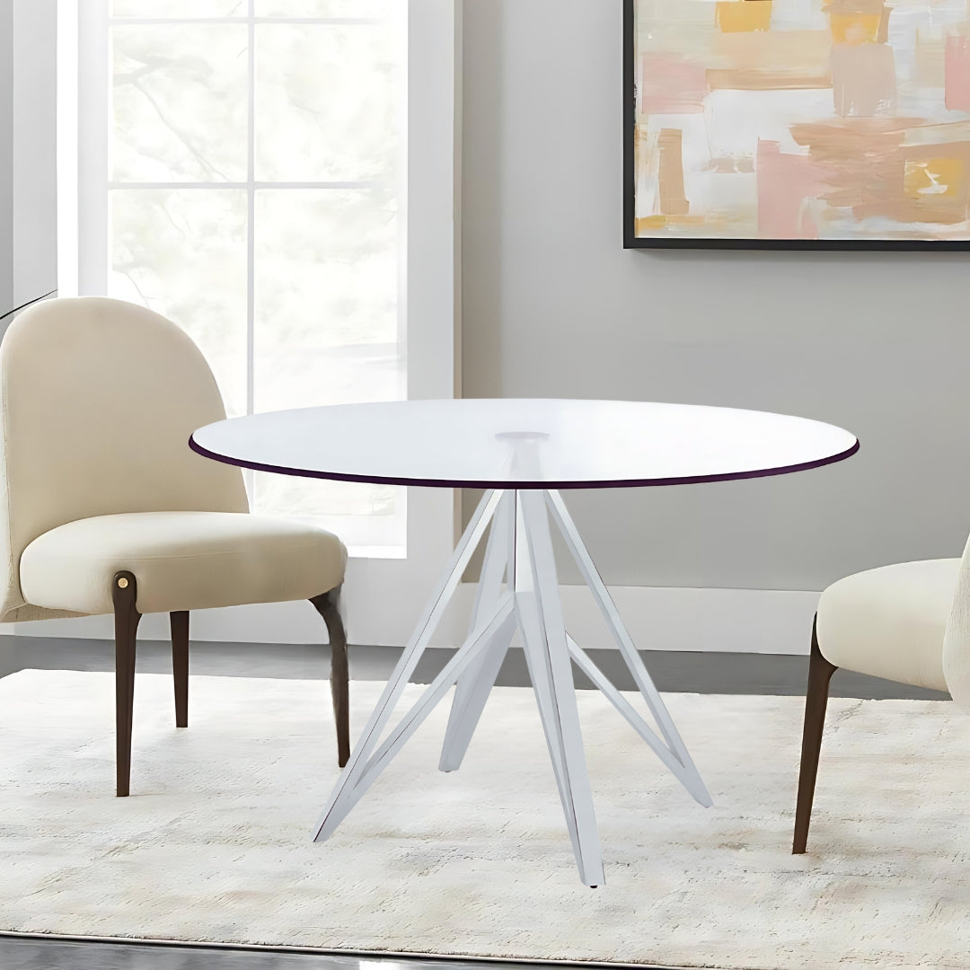 "The Focus" Dining Table is the epitome of modern dining elegance, featuring a sleek metal frame and a pristine glass top.
Designed with a simplistic yet futuristic base, this round dining table showcases a polished stainless steel finish that adds a touch of contemporary luxury to any dining space.