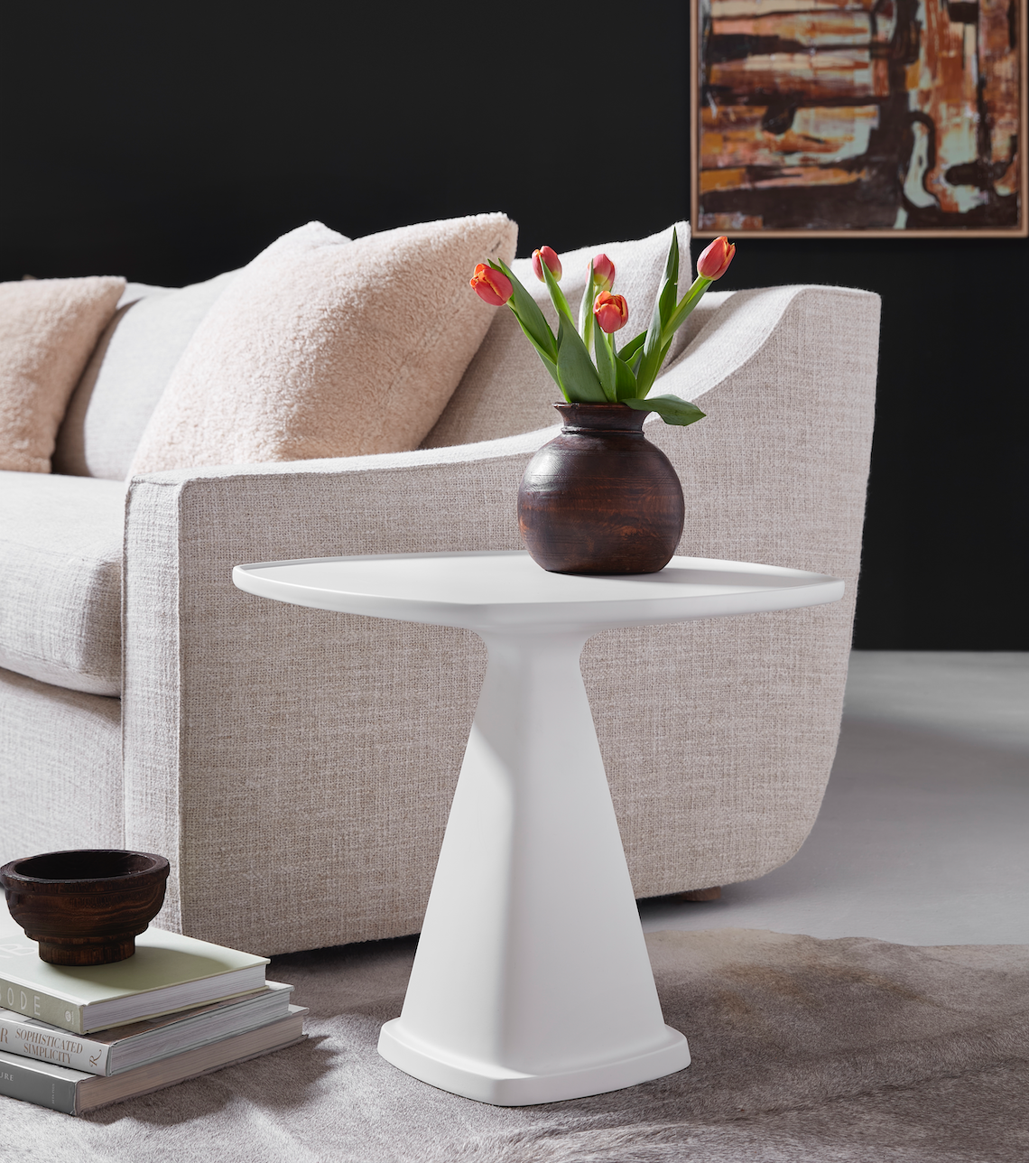 Pictured in this lifestyle photo in the solid white finish, The Oscar Side Table is a stylish and functional resin accent table that brings a contemporary edge to any room.
Made in America, this table is designed with a broader tabletop and a shorter, sturdy base, offering the perfect balance between practicality and modern design. With its sleek lines and versatile finish options, the Oscar Side Table complements any living space, whether used as a chairside companion or a decorative accent piece.
