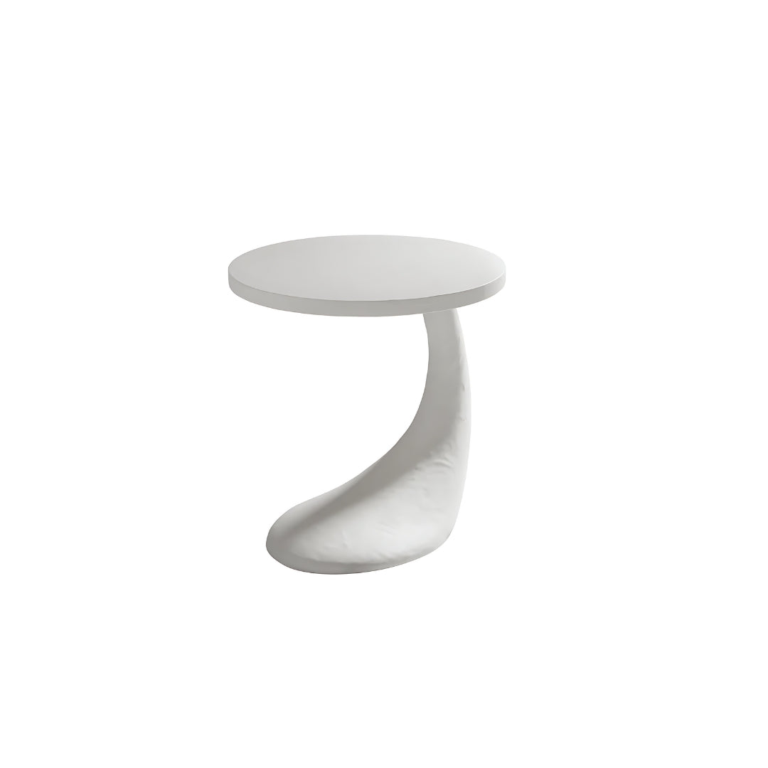 Pictured here in this silo photo, The Cornucopia End Table brings a touch of whimsy and artistic flair to any sitting room with its playful form and distinct plaster texture.
This funky and unique table is more than just a functional piece—it's a true conversational centerpiece that captures attention and sparks curiosity. The Cornucopia features a one-of-a-kind sculptural base that defies convention, making it the perfect choice for those who appreciate bold, avant-garde design.