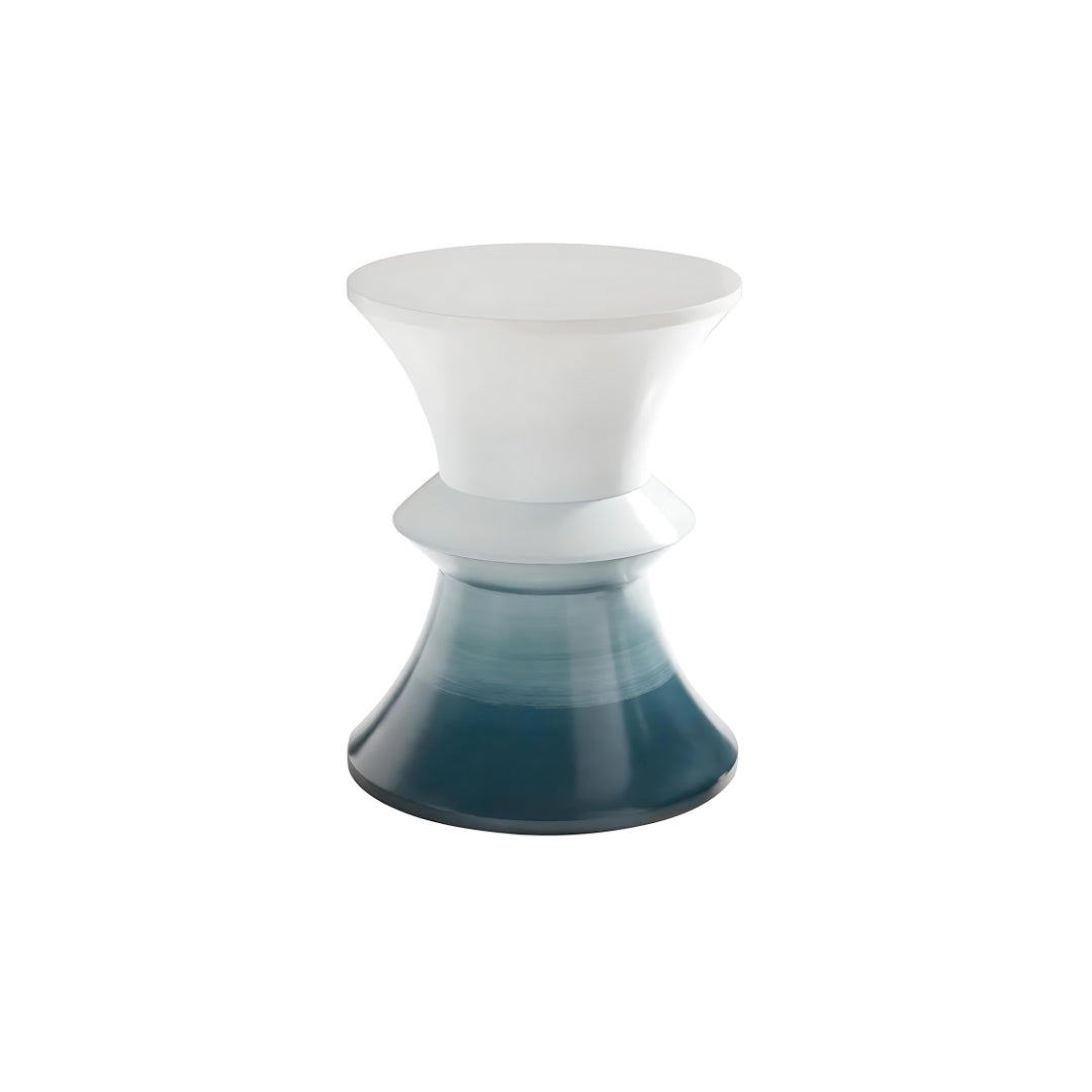 This is a silo shot of the Cuff from Modern Elements, showcasing the resin table's hourglass silhouette and blue to white gradient finish.