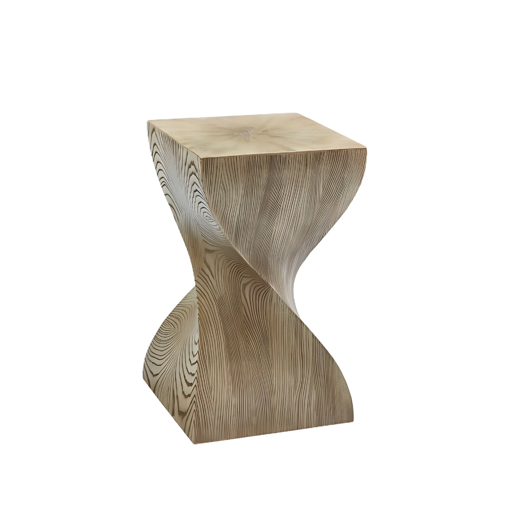 Pictured here in this silo shot, The Twist End Table, with a sleek design and clean lines, is a modern end table that effortlessly enhances a variety of living spaces, from contemporary living rooms to chic lounge areas.
The natural wood grain cerused oak finish adds an organic touch, blending modern design with a nod to natural elements. This versatile resin table is perfect for those looking to elevate their home decor by combining minimalist elegance with earthy, organic components.