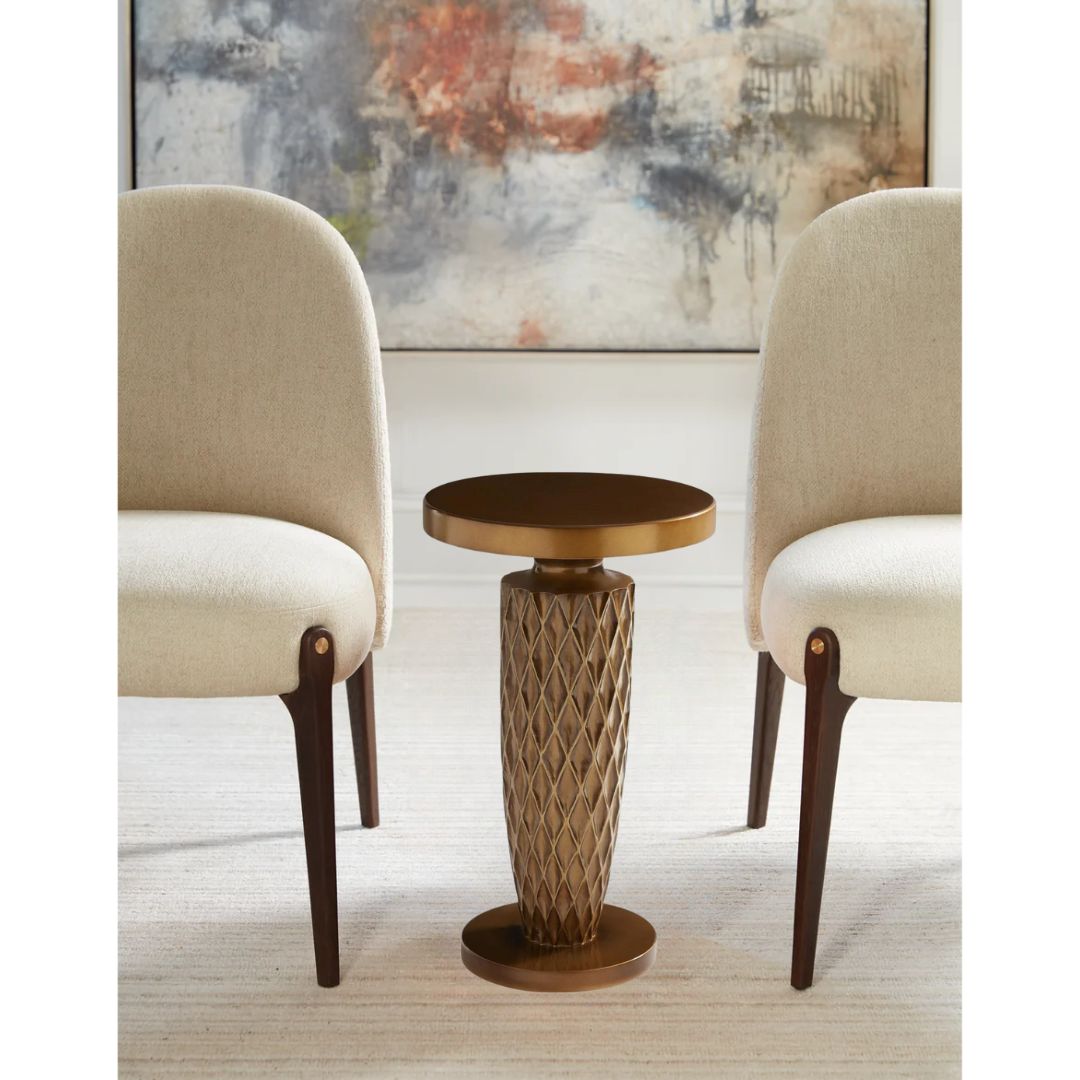 Pictured here in this lifestyle shot, The Vesper Pull-Up Table is a beautifully crafted American-made accent table that combines exceptional craftsmanship with a striking sculptural design.
Featuring a uniquely molded base and a sleek round tabletop, this versatile piece is perfect for resting decor or practical items in living rooms or lounge areas. The Vesper Pull-Up Table stands out with its artistic appeal, making it more than just a functional piece—it's a true statement of classic style.