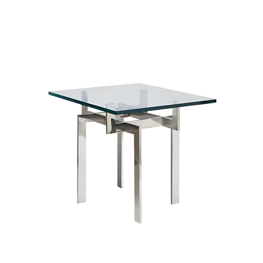 Pictured here is the Zig Zag Accent table by Modern Elements Furniture. With its sleek stainless steel frame and square glass tabletop, this modern accent table features an intricate base that creates a captivating optical illusion, where the legs appear to twist and intersect in a geometric dance. The unique sculptural design adds a sophisticated touch to your decor, making it perfect for displaying decor, holding lamps, or serving as a stylish side table.