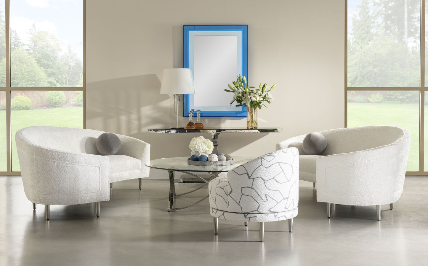 Pictured in this lifestyle photo, the Gelo Mirror continues the bold, futuristic design of its sister pieces, the Gelo cocktail and Gelo console, making it a striking addition to any modern space.
Featuring blue acrylic panels and a meticulously crafted geometric frame, this mirror embodies contemporary sophistication with a futuristic twist. The Gelo Mirror is more than just a functional piece; it's a statement of style, seamlessly blending art and utility.