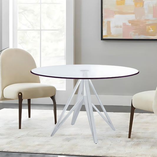 "The Focus" Dining Table is the epitome of modern dining elegance, featuring a sleek metal frame and a pristine glass top.

Designed with a simplistic yet futuristic base, this round dining table showcases a polished stainless steel finish that adds a touch of contemporary luxury to any dining space.