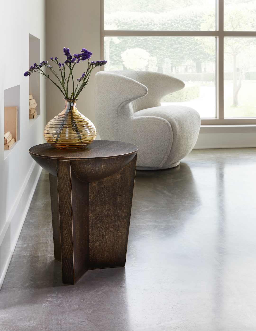 Pictured here in this lifestyle shot, the Luna resin side table is the perfect contemporary accent for your living space. Featuring a rounded top and a three-part attachment leg base, the Luna is manufactured in America with high quality resin.