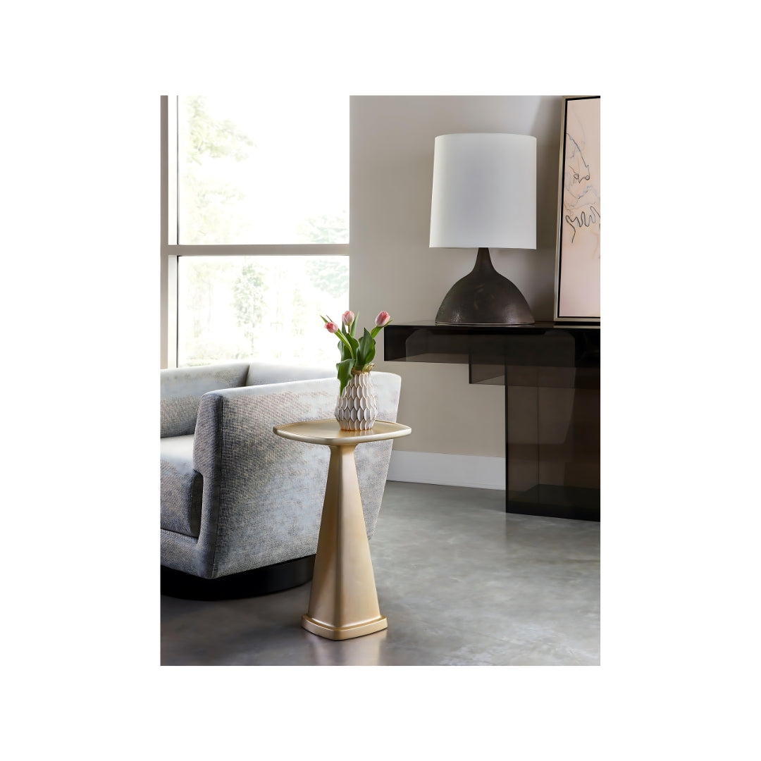 Pictured in this lifestyle photo and shown in the champagne finish, The Oscar Pull-Up Drink Table is a sleek and stylish resin accent table that perfectly balances form and function.

Proudly made in America, this table features a slender base and a well-proportioned tabletop, making it ideal for tight spaces or cozy nooks. With its sleek lines and a range of gorgeous finish options, the Oscar Pull-Up Drink Table is a versatile piece that adds a contemporary touch to any living space. 