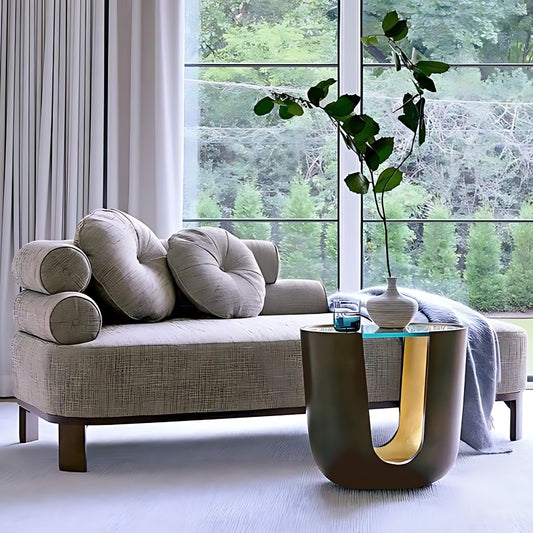 This is a lifestyle shot of the Soleil Pull Up Table in a bronze / gold leaf finish by Modern  Elements Furniture.
