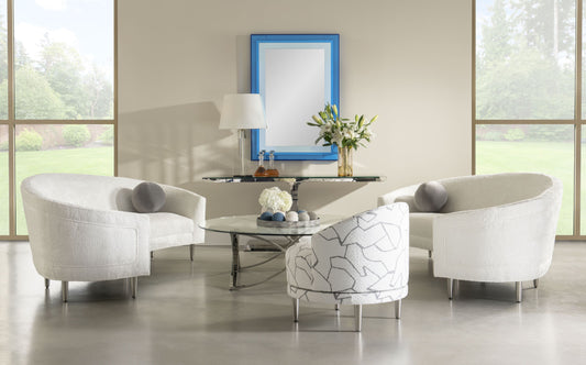 Pictured in this lifestyle photo, the Gelo Mirror continues the bold, futuristic design of its sister pieces, the Gelo cocktail and Gelo console, making it a striking addition to any modern space.

Featuring blue acrylic panels and a meticulously crafted geometric frame, this mirror embodies contemporary sophistication with a futuristic twist. The Gelo Mirror is more than just a functional piece; it's a statement of style, seamlessly blending art and utility.