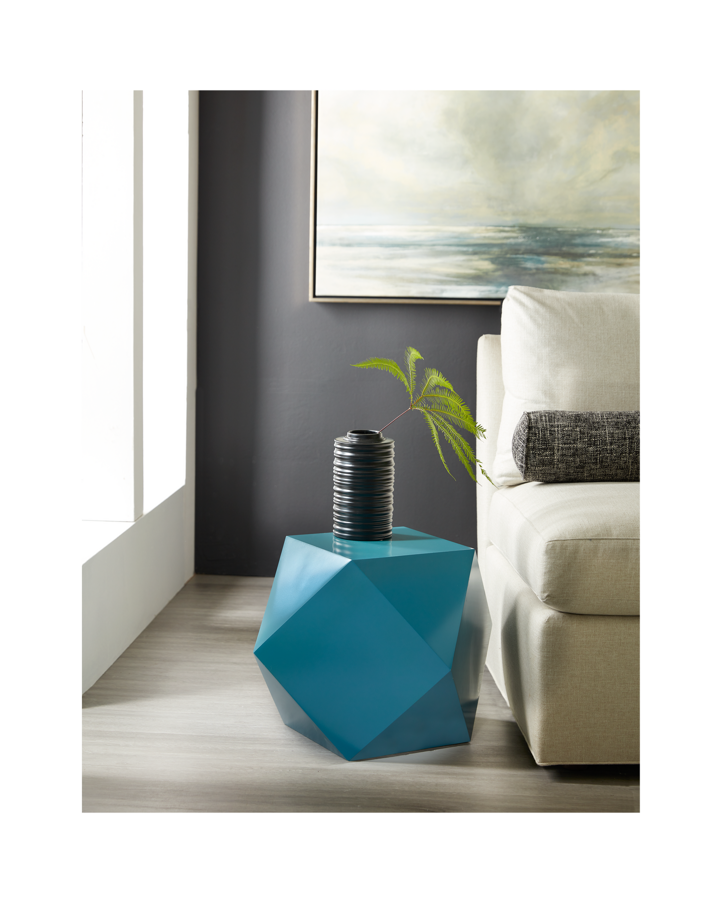 The Tetra Pull-Up Table is a vibrant and stylish accent piece that brings a touch of modern flair to any room. Proudly made in America with exceptional quality craftsmanship, this geometric spot table features a unique cast design that adds depth and dimension to your decor, making it a lively addition to living rooms, bedrooms, or lounge areas. 